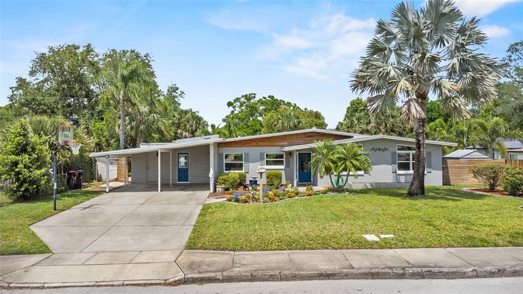 4011 Bobolink Lane Orlando, FL 32803 - Photo 1 of 47 a front view of house with yard and green space