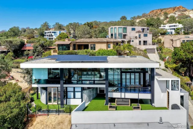 a view of a white building among the city view and fountain