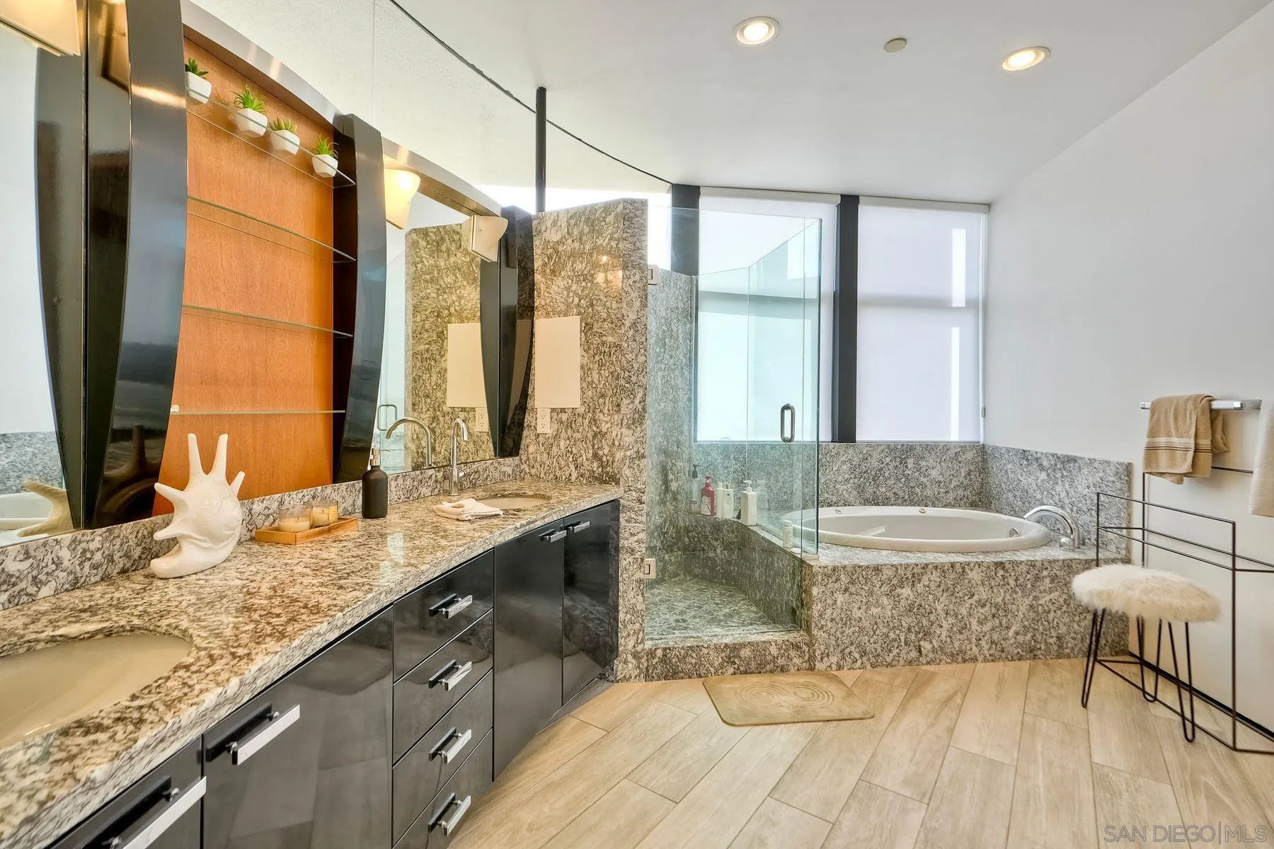 12911 Via Grimaldi Del Mar, CA 92014 - Photo 14 of 41 a bathroom with a granite countertop sink and a large mirror