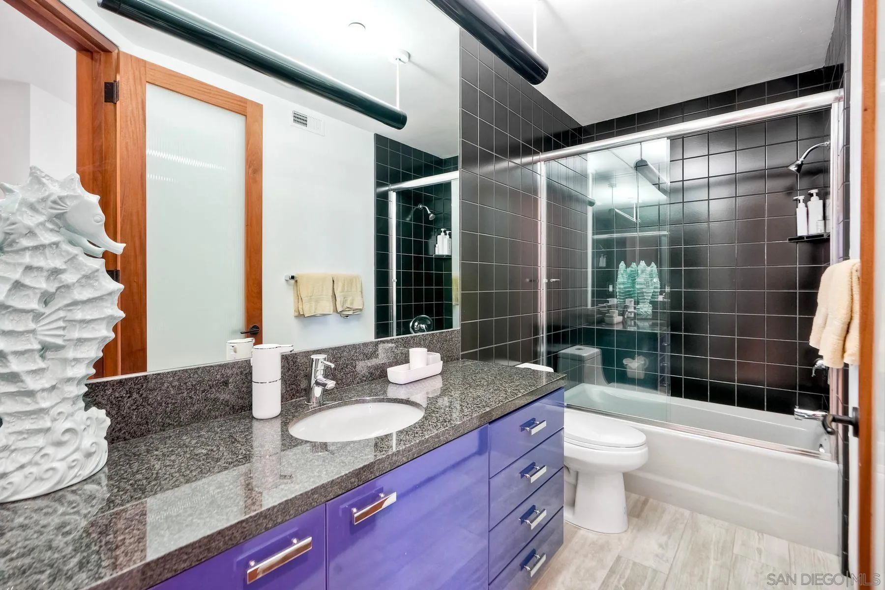 12911 Via Grimaldi Del Mar, CA 92014 - Photo 19 of 41 a bathroom with a granite countertop sink toilet tub and shower