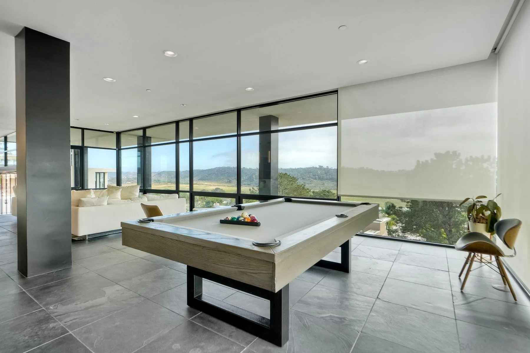 12911 Via Grimaldi Del Mar, CA 92014 - Photo 20 of 41 a living room with dining table furniture and a floor to ceiling window