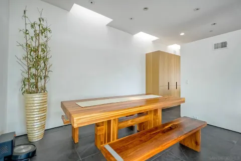 a room with furniture and a potted plant