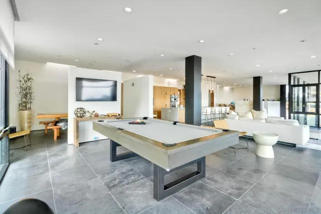 a bedroom with furniture and a chandelier