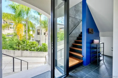 a bedroom with a bed and a couch