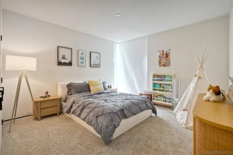 a bedroom with a workspace