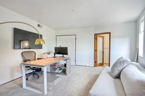 a view of a terrace with couches and city view