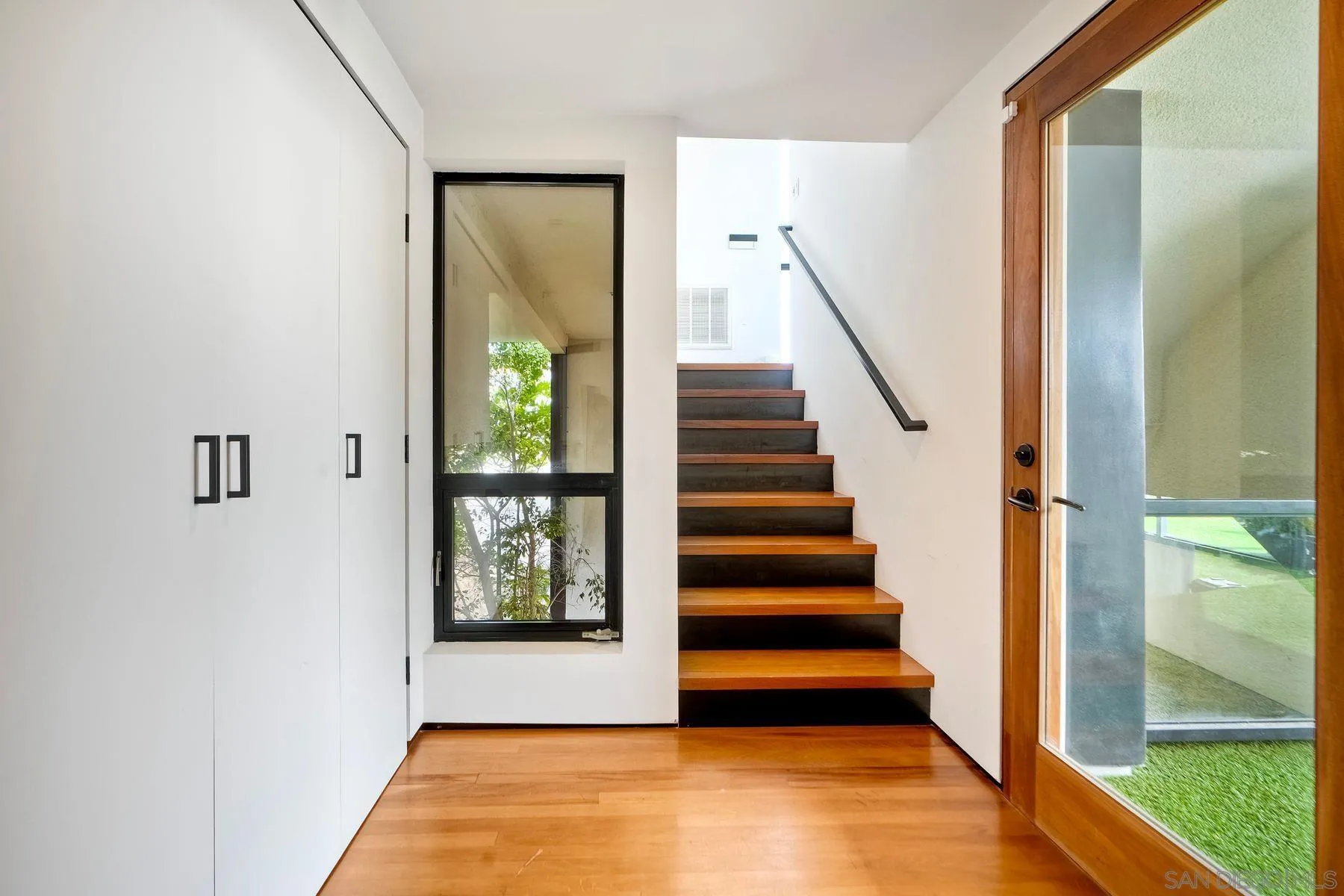 12911 Via Grimaldi Del Mar, CA 92014 - Photo 32 of 41 a view of entryway with wooden floor and front door