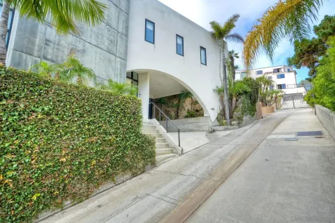 an aerial view of a house with a yard and garden