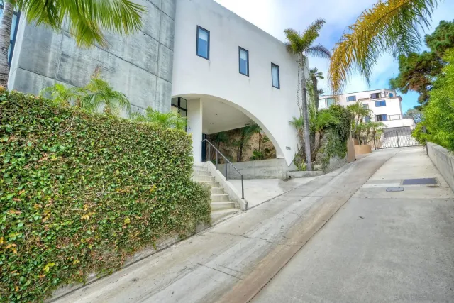an aerial view of a house with a yard and garden