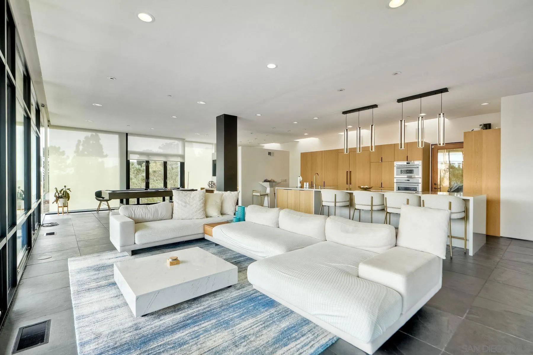 12911 Via Grimaldi Del Mar, CA 92014 - Photo 8 of 41 a living room with furniture and a large window