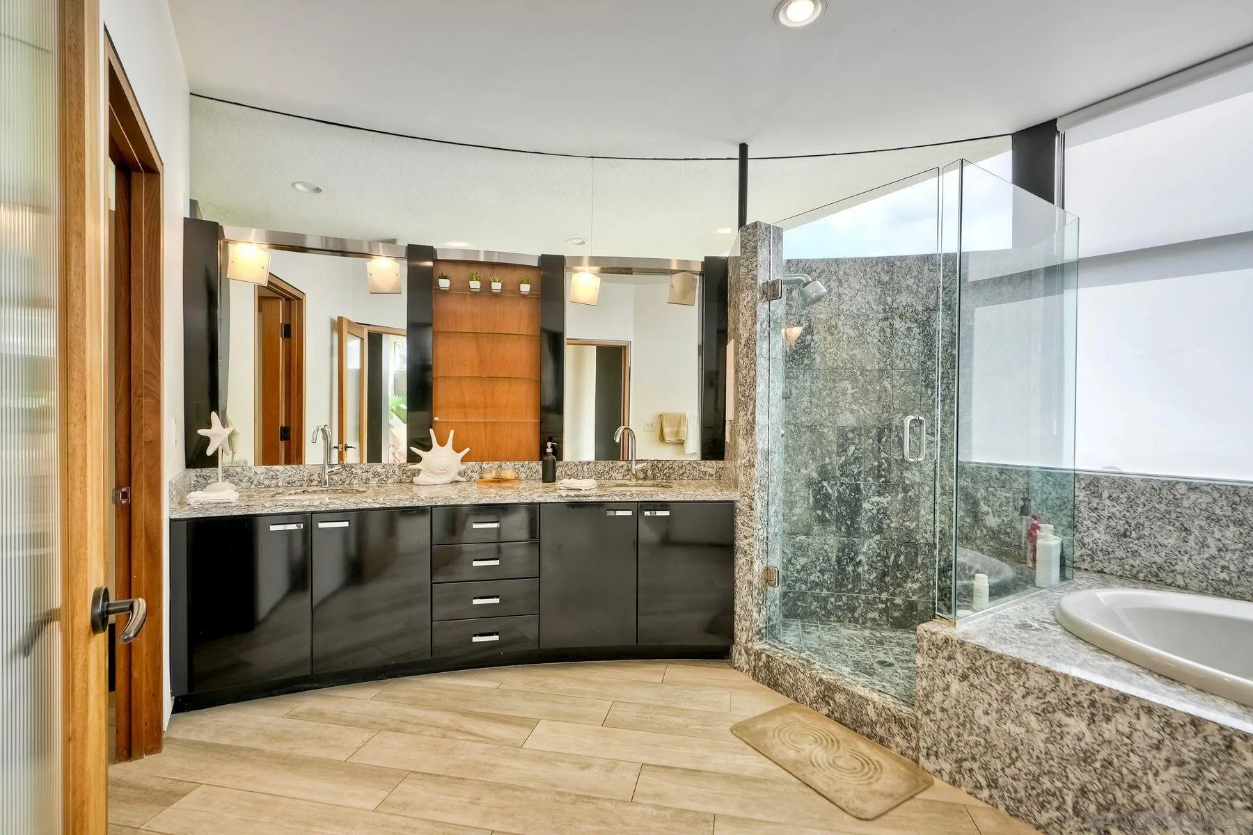 12911 Via Grimaldi Del Mar, CA 92014 - Photo 9 of 41 a bathroom with a granite countertop sink and a bathtub