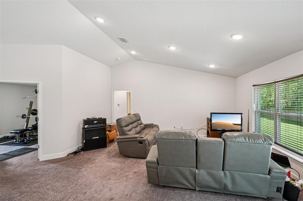67 Northwest 45th Loop Ocala, FL 34475 - Photo 15 of 27 a living room with furniture and a window