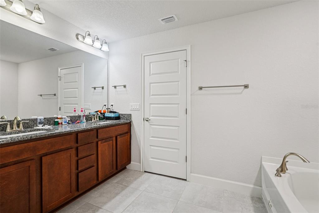 67 Northwest 45th Loop Ocala, FL 34475 - Photo 18 of 27 a bathroom with a sink and a mirror
