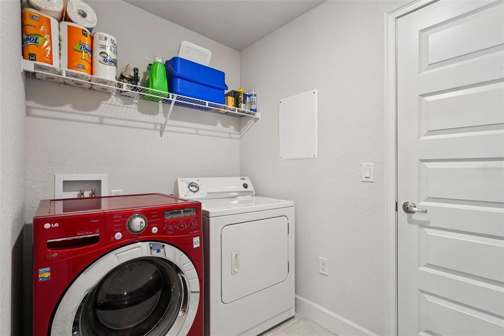 67 Northwest 45th Loop Ocala, FL 34475 - Photo 22 of 27 a utility room with dryer and washer