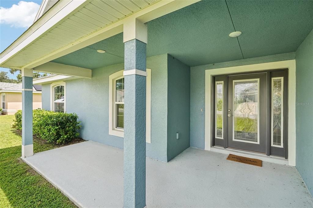 67 Northwest 45th Loop Ocala, FL 34475 - Photo 27 of 27 a front view of a house with garden