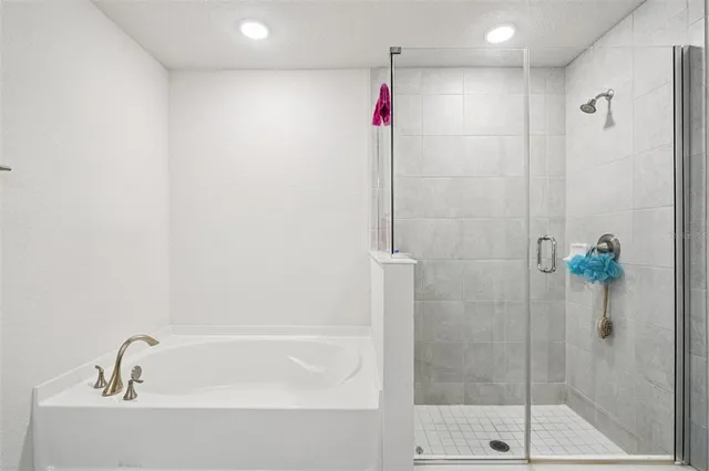 a bathroom with a shower and a sink