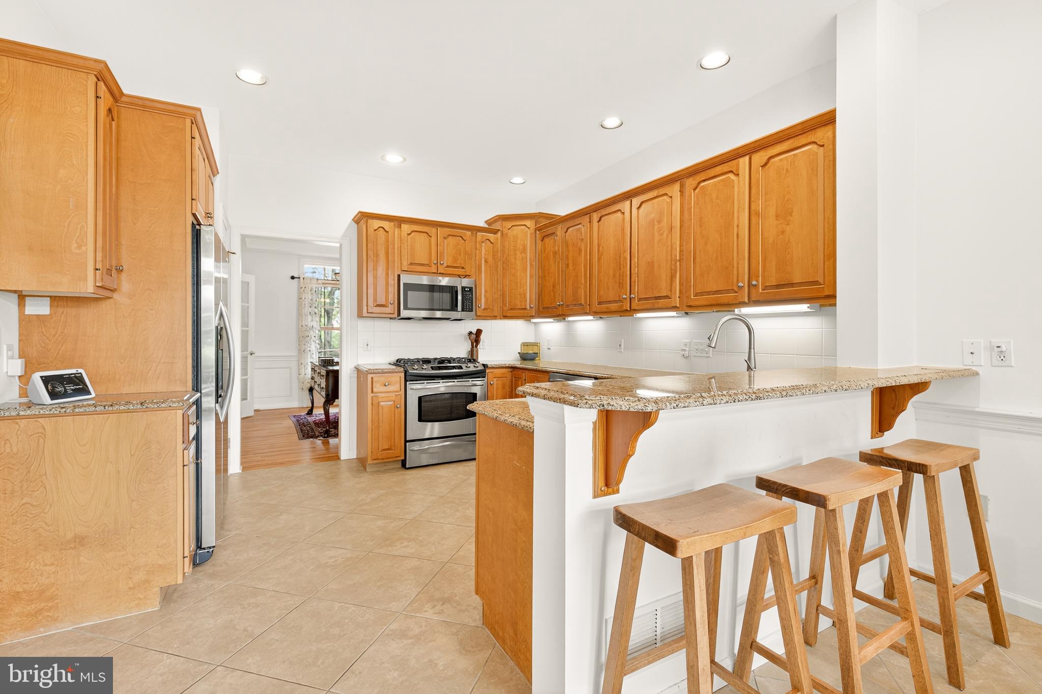 634 Northfield Road Lititz, PA 17543 - Photo 11 of 34 a kitchen with stainless steel appliances granite countertop a refrigerator and a stove top oven