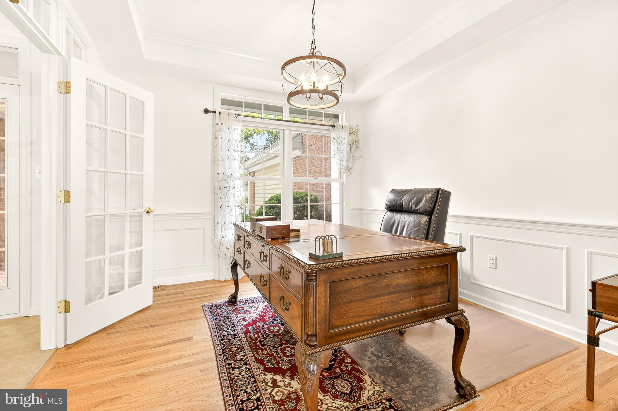 634 Northfield Road Lititz, PA 17543 - Photo 15 of 34 a view of a livingroom with furniture wooden floor windows and a chandelier