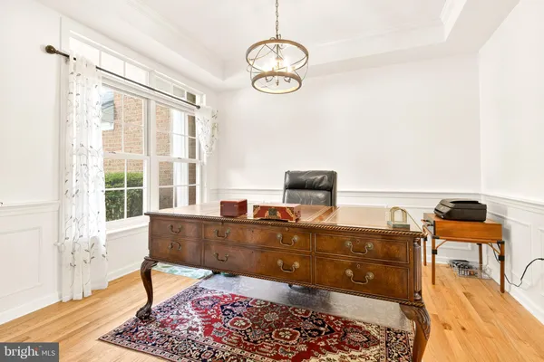 a view of staircase with railing and white walls