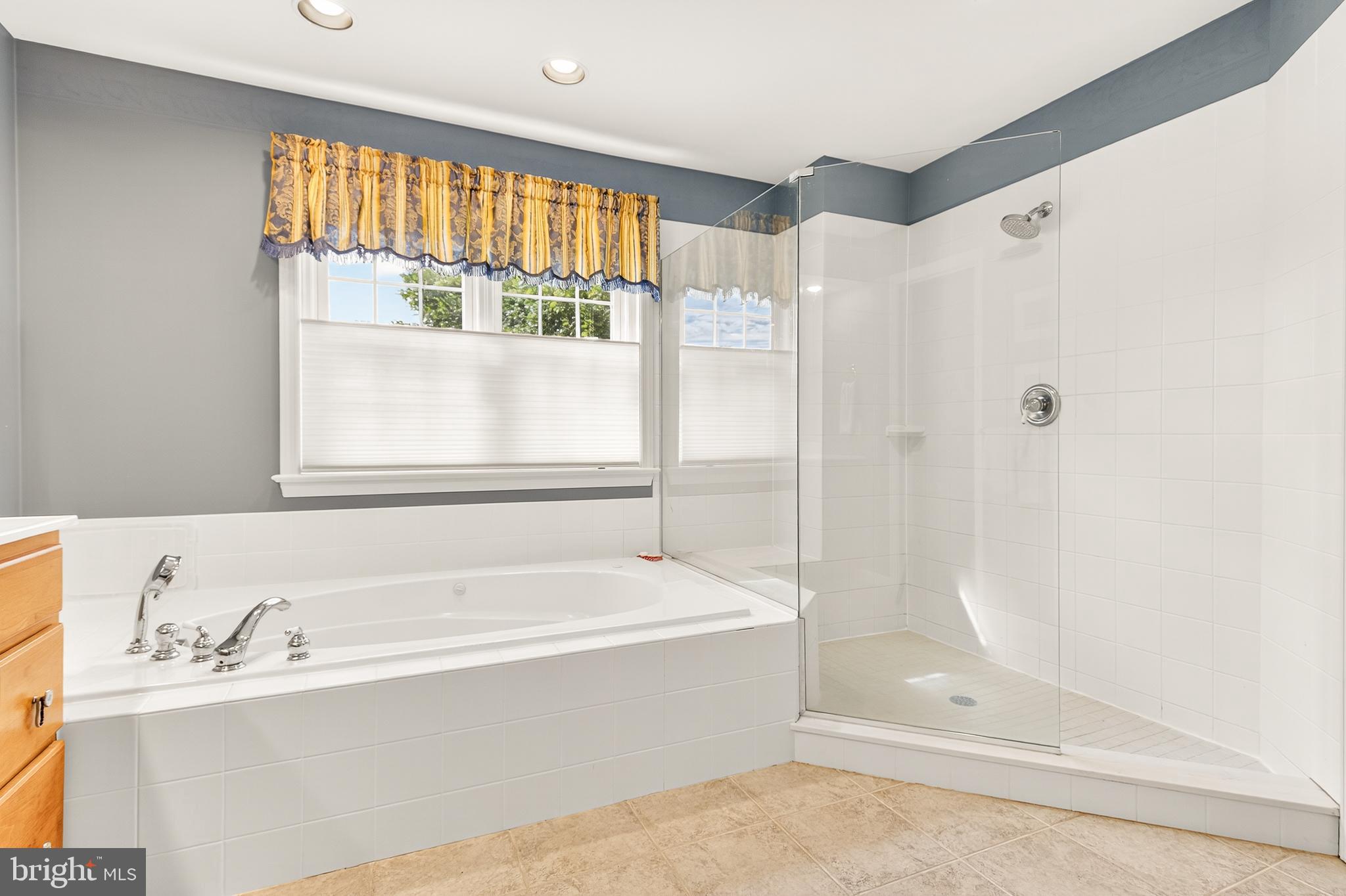 634 Northfield Road Lititz, PA 17543 - Photo 21 of 34 a bathroom with a bathtub and a shower