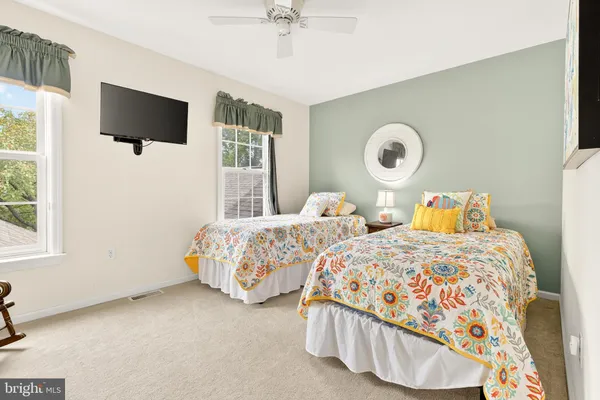 a view of a patio with furniture and a fire pit