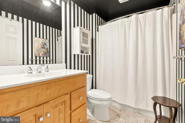 a view of a patio with table and chairs and potted plants