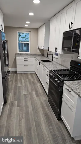 a kitchen with kitchen island cabinets and window