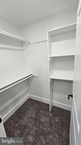 a room with cabinets and wooden floor