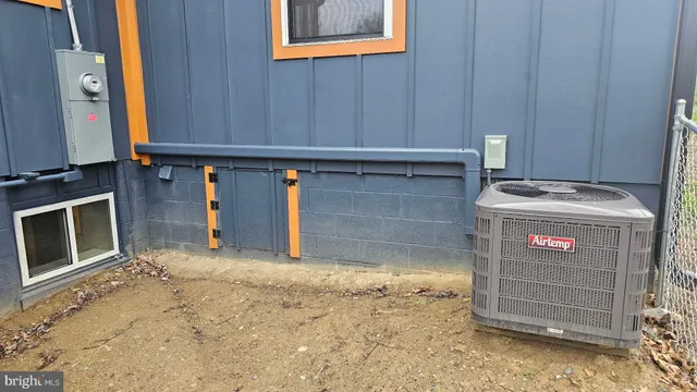a view of a room with wooden floor and cabinet