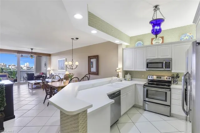 a very nice looking kitchen with a large window