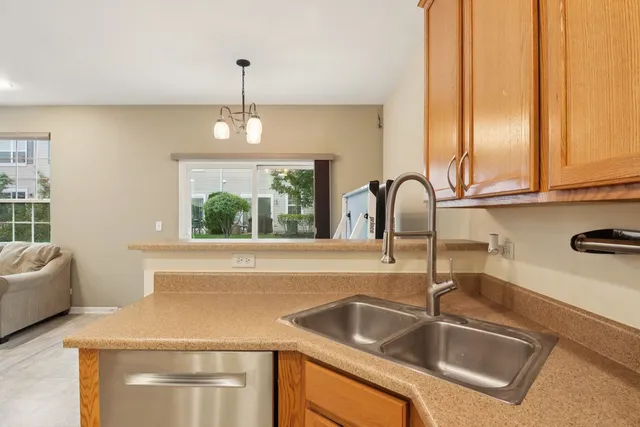 a kitchen with a sink and a window