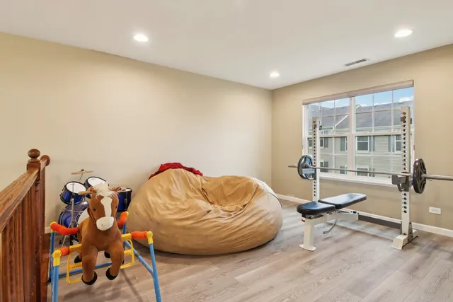 a room with furniture and gym equipment
