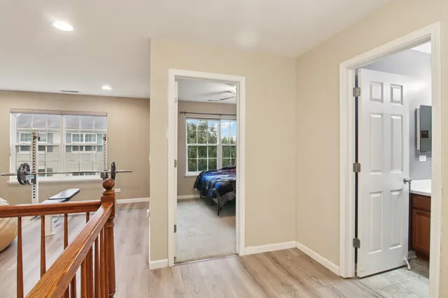a view of a livingroom with furniture and hardwood floor