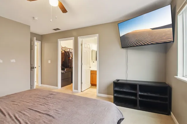 a bedroom with a bed and a dresser