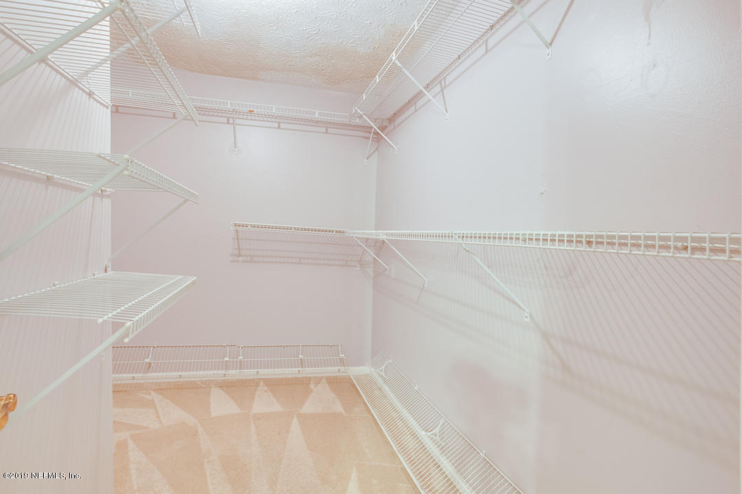 11366 Harts Road Jacksonville, FL 32218 - Photo 11 of 23 a view of a room with racks on the wall
