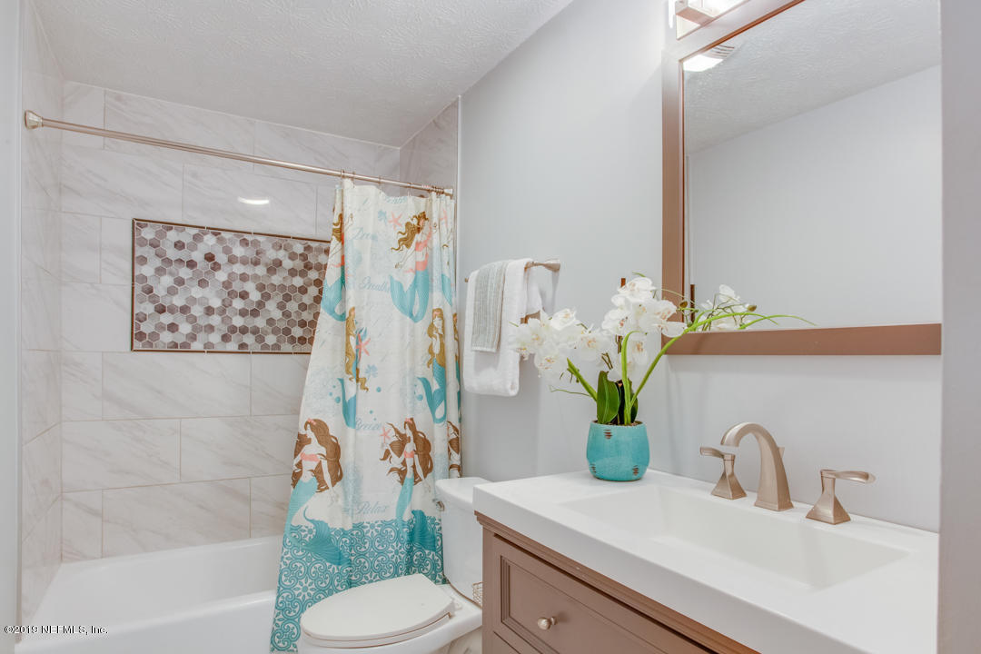 11366 Harts Road Jacksonville, FL 32218 - Photo 12 of 23 a bathroom with a sink a toilet and a shower