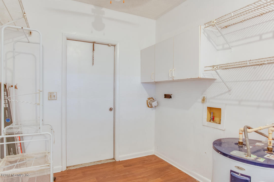 11366 Harts Road Jacksonville, FL 32218 - Photo 14 of 23 a view of a room with wooden floor and cabinet