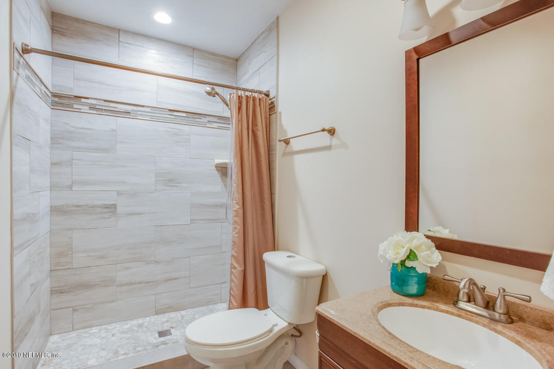 11366 Harts Road Jacksonville, FL 32218 - Photo 17 of 23 a bathroom with a sink toilet and shower