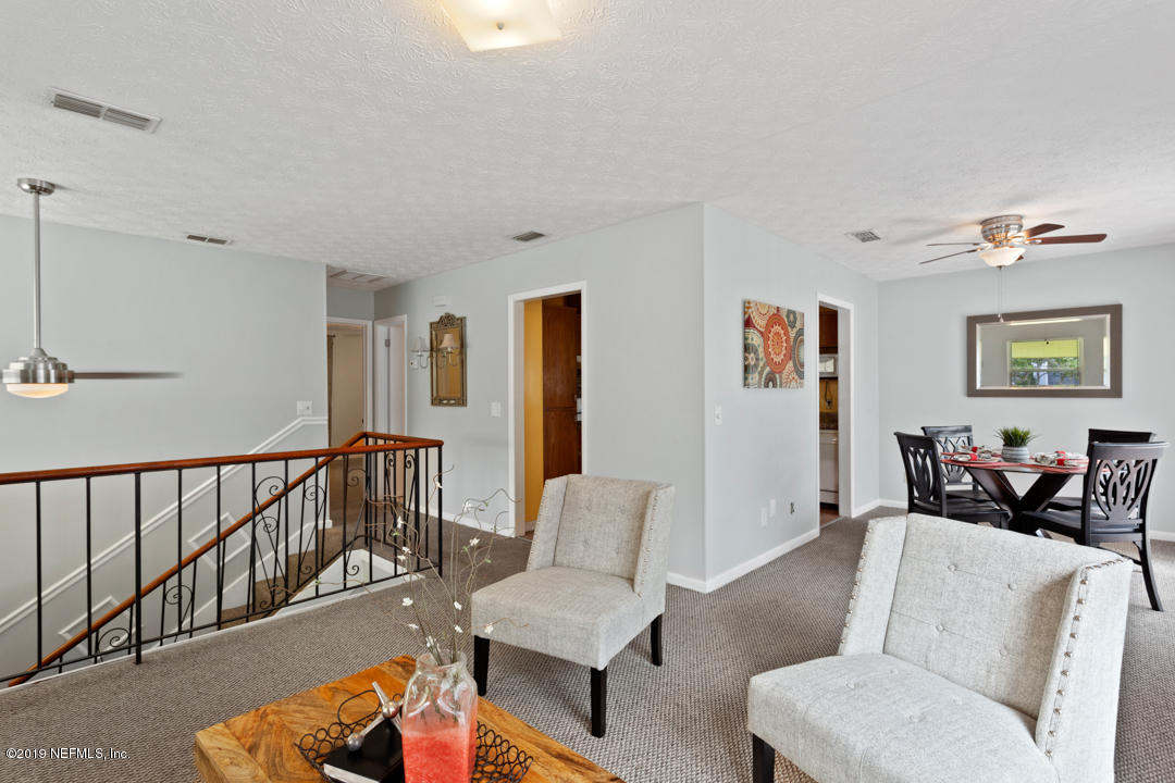 11366 Harts Road Jacksonville, FL 32218 - Photo 5 of 23 a living room with furniture and a wooden floor