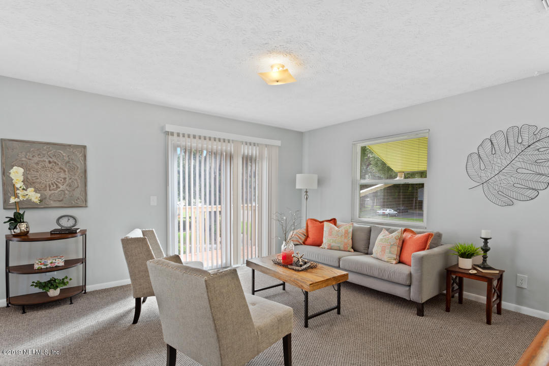 11366 Harts Road Jacksonville, FL 32218 - Photo 7 of 23 a living room with furniture and a window