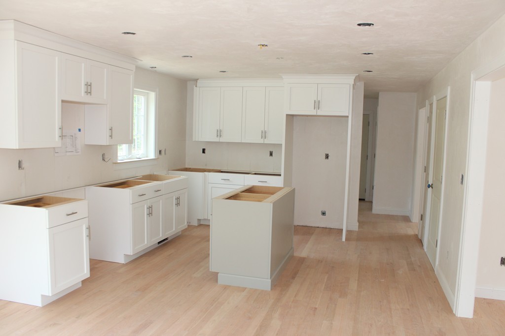 10 Stony Point Road Middleboro, MA 02346 - Photo 8 of 17 a kitchen with white cabinets and white appliances