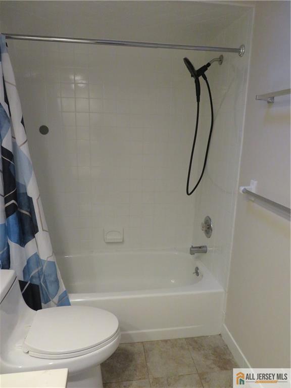 601 Maplecrest Road Edison, NJ 08820 - Photo 17 of 27 a bathroom with a shower and a toilet