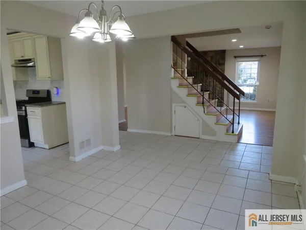 a view of a kitchen with granite countertop cabinets and wooden floor