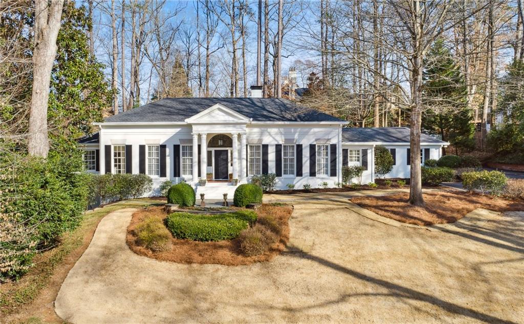 3511 Paces Valley Road Northwest Atlanta, GA 30327 - Photo 1 of 1 front view of a house with a patio