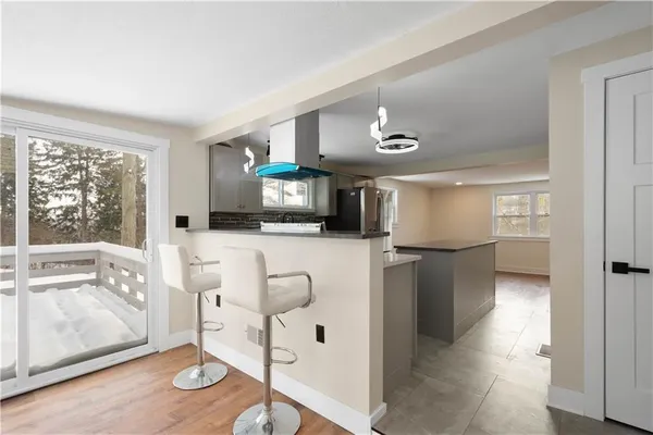 a view of living room with furniture and flat screen tv