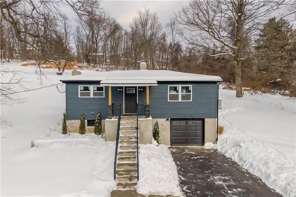 a front view of a house with a couch