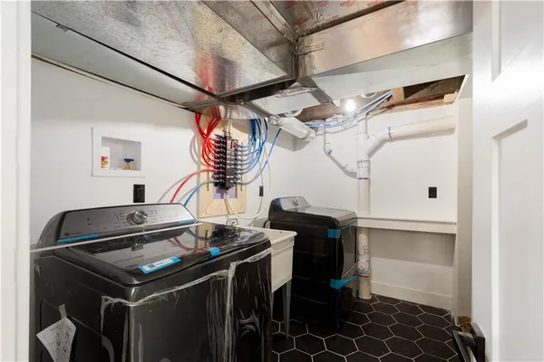 a kitchen with stainless steel appliances granite countertop a stove and a microwave