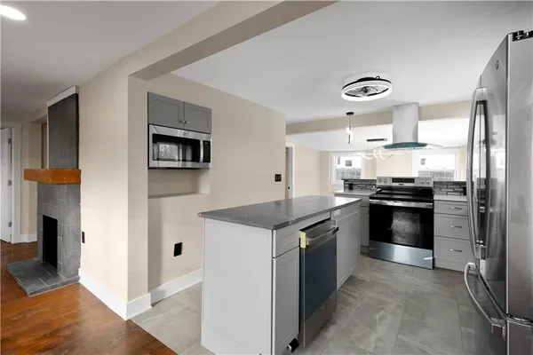 a kitchen with a stove and a refrigerator