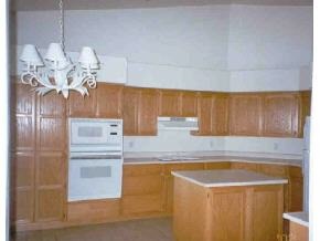 528 Miracle Rider Road, Unit YAV Prescott, AZ 86301 - Photo 7 of 10 a kitchen with a refrigerator and chandelier