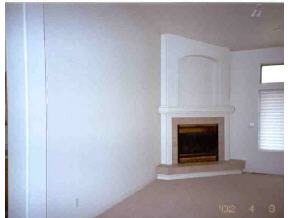 528 Miracle Rider Road, Unit YAV Prescott, AZ 86301 - Photo 8 of 10 a view of an empty room with a fireplace and a window